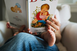 baby toes with book photographed by boston photographer nicole loeb