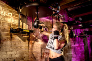 female boxer Allison Kemon trains for Haymakers of Hope at Everybody Fights gym photographed by Boston fitness photographer nicole loeb